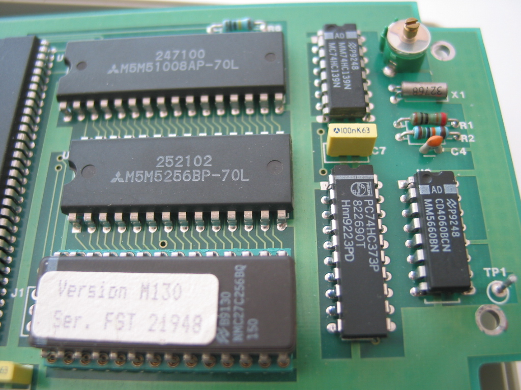 Digital PCB close-up showing EPROM label Version M130 Ser FST 21948 and RAM chips